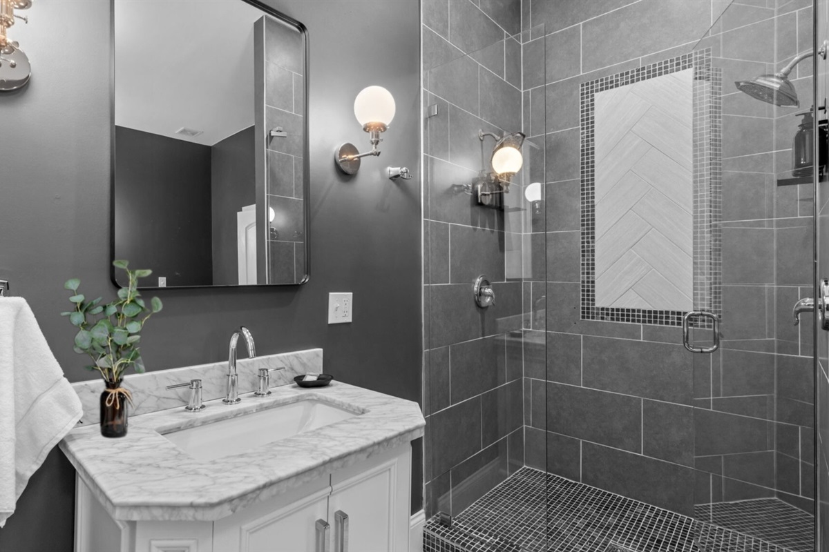 A separate spacious shower provides dual shower heads!  Use your imagination on how to use them!!