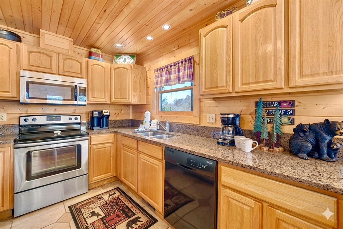 Whip up hearty breakfasts or late-night snacks in this fully equipped kitchen. The warm wood finishes and mountain décor make cooking feel like part of the cabin experience.