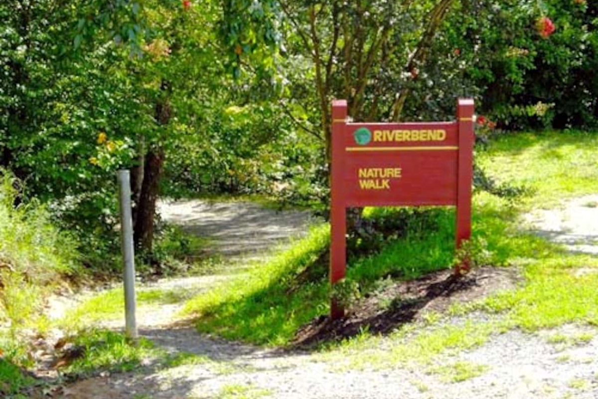 Located directly across the road from the private Mirror Lake: Hike down this trail to find the waterfall and the river.
