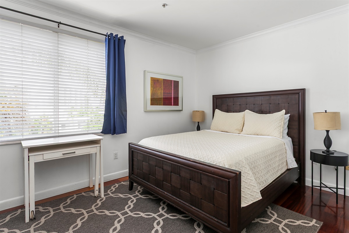 Guest Suite with en-suite bath, closet storage, and room-darkening curtains