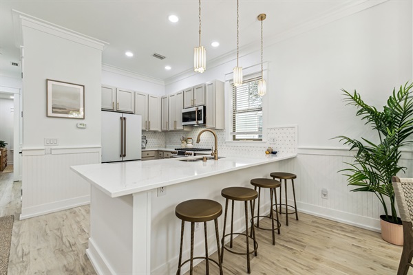 Peninsula counter with counter stools for extra seating.  Can be used as a workspace.