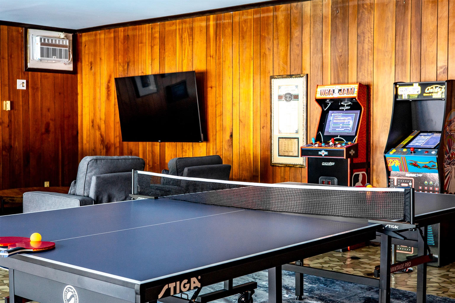 Game room with ping pong table, NBA Jam & Mrs. Pacman/Galaga arcade games.