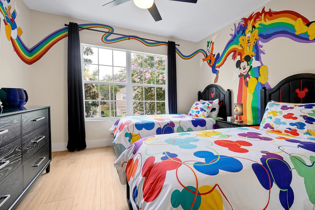 Mickey’s Rainbow Magic – Two twin beds, closet storage and TV