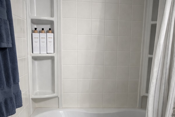 The beach bathroom includes a soaking tub for relaxation.