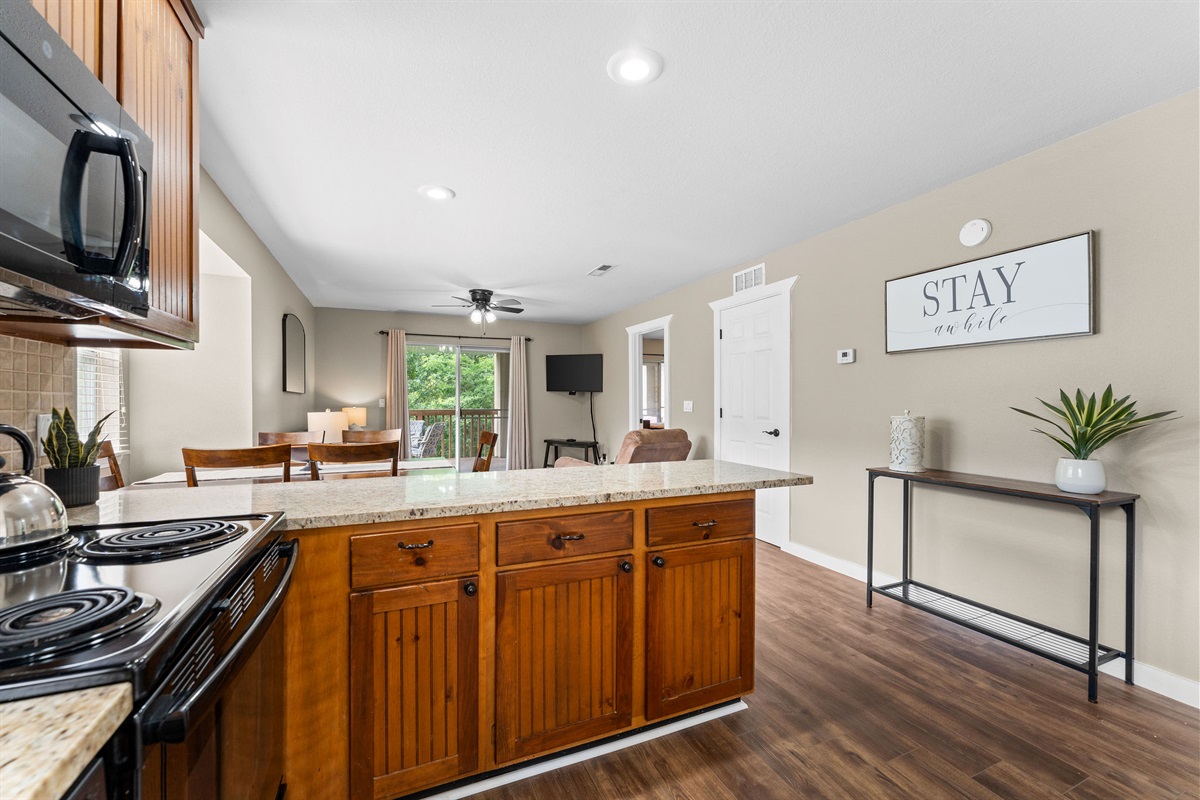 You'll experience having a roomy layout with a full kitchen, dining table, and cozy living area.
