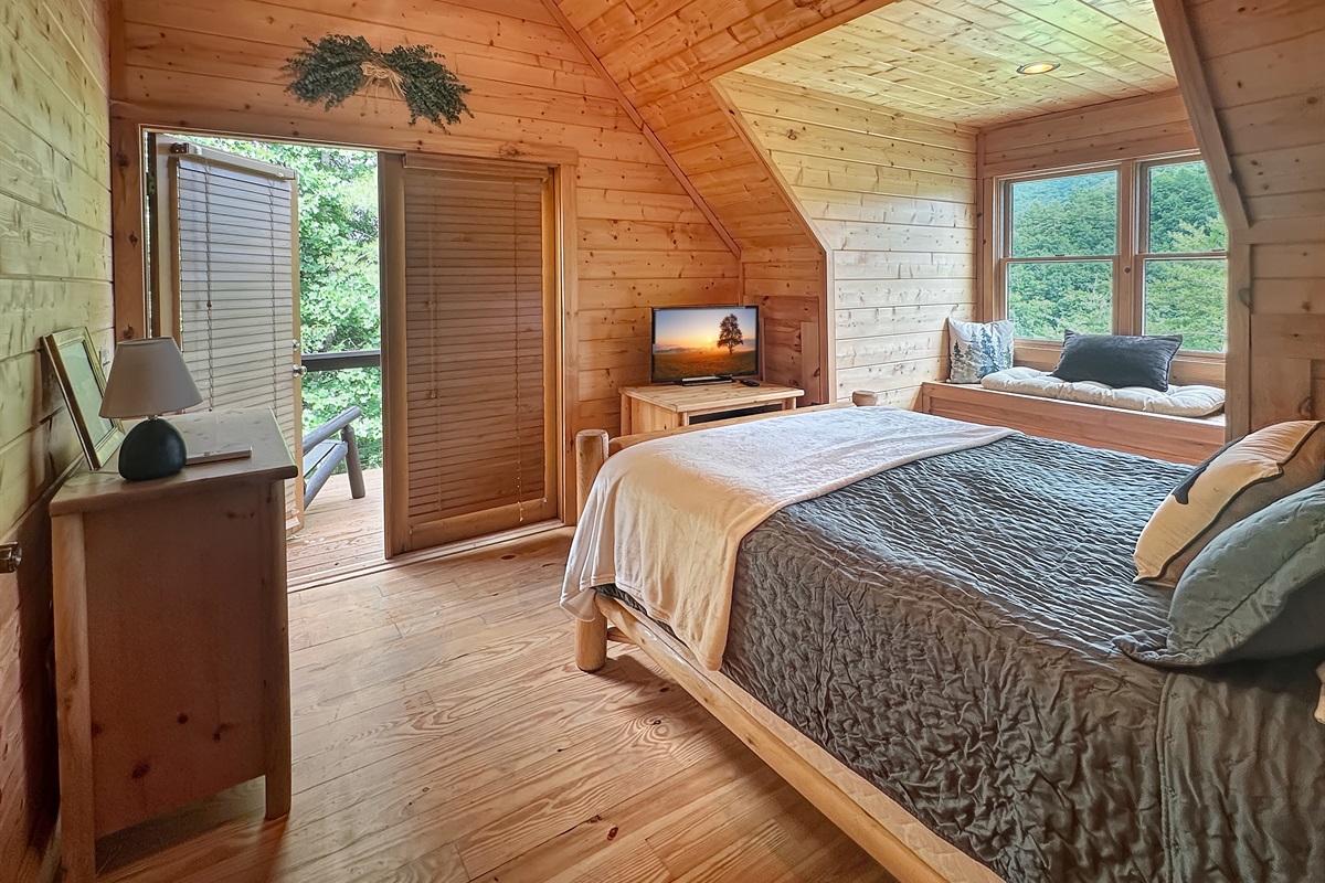Bedroom: Sun-drenched retreat with stunning mountain views and rustic charm awaits your escape!