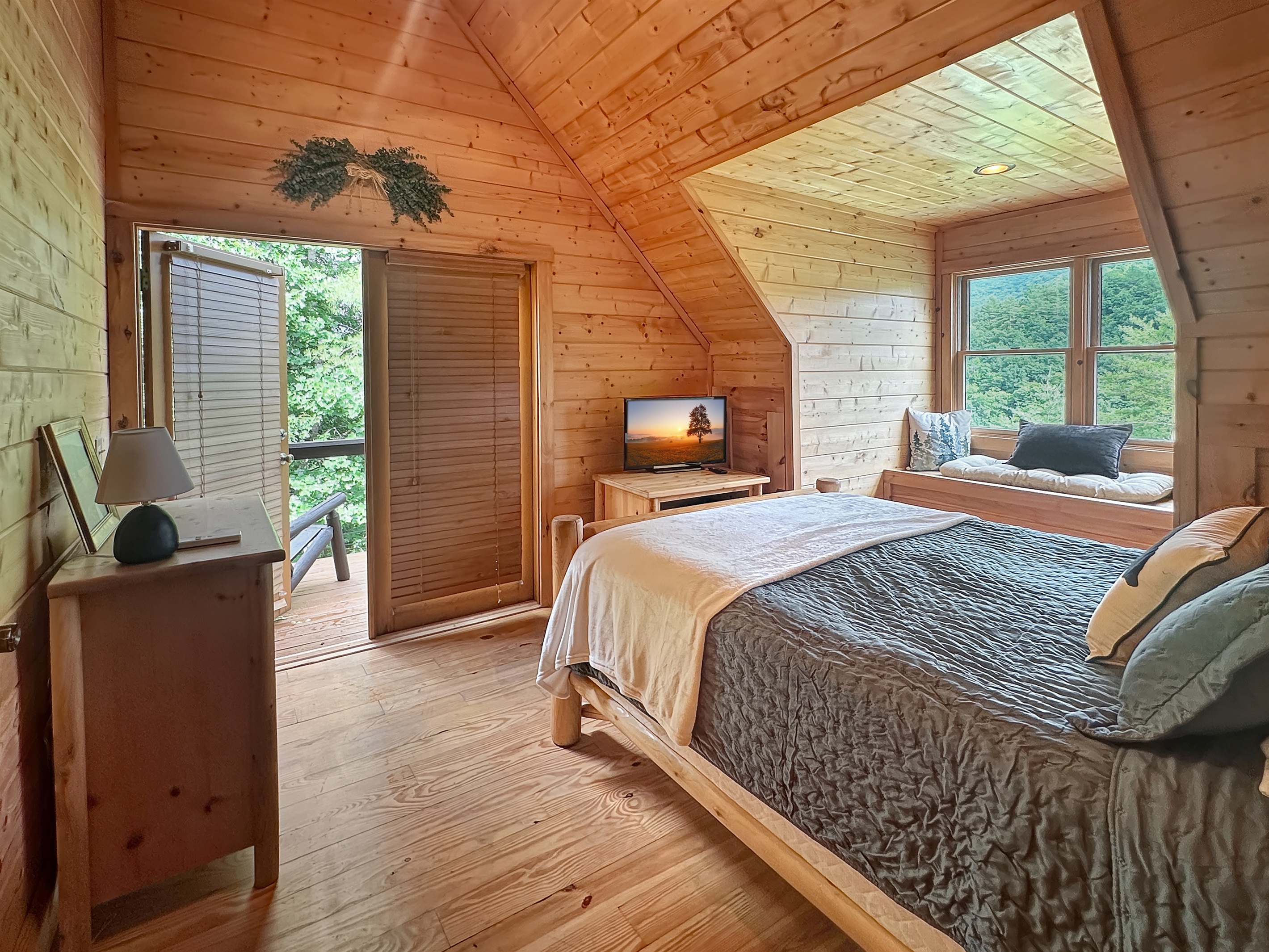 Bedroom: Sun-drenched retreat with stunning mountain views and rustic charm awaits your escape!