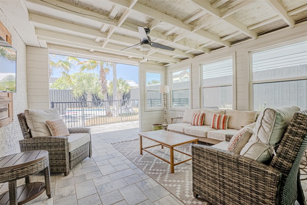 Covered outdoor patio area with seating