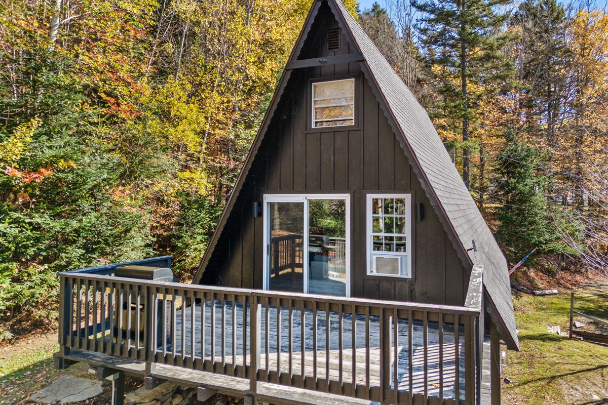 View of the house with the deck off the main floor. 