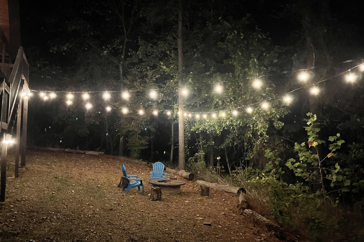 First Kiss Party lights over the backyard fire pit - just for the two of you.
