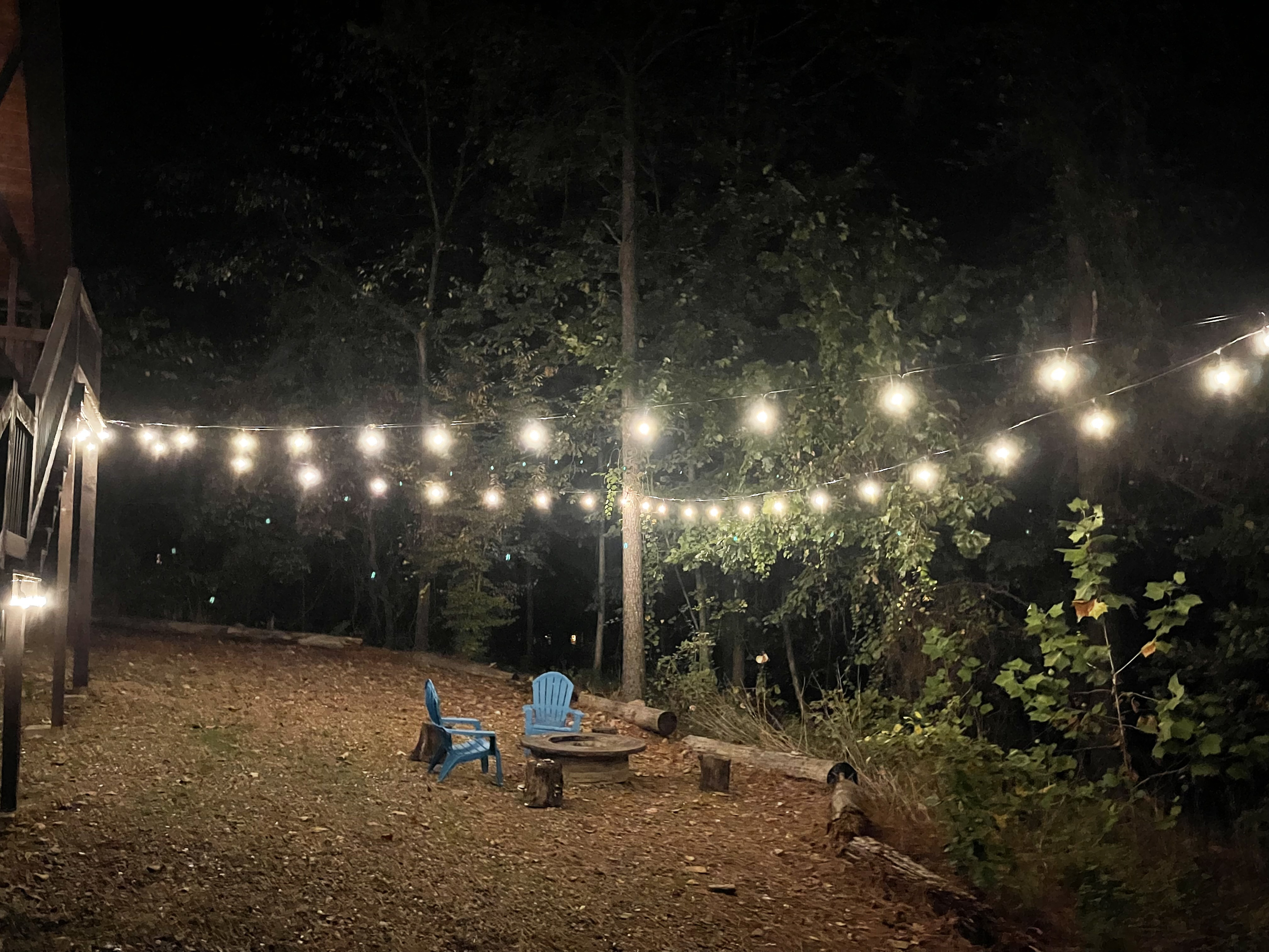 First Kiss Party lights over the backyard fire pit - just for the two of you.