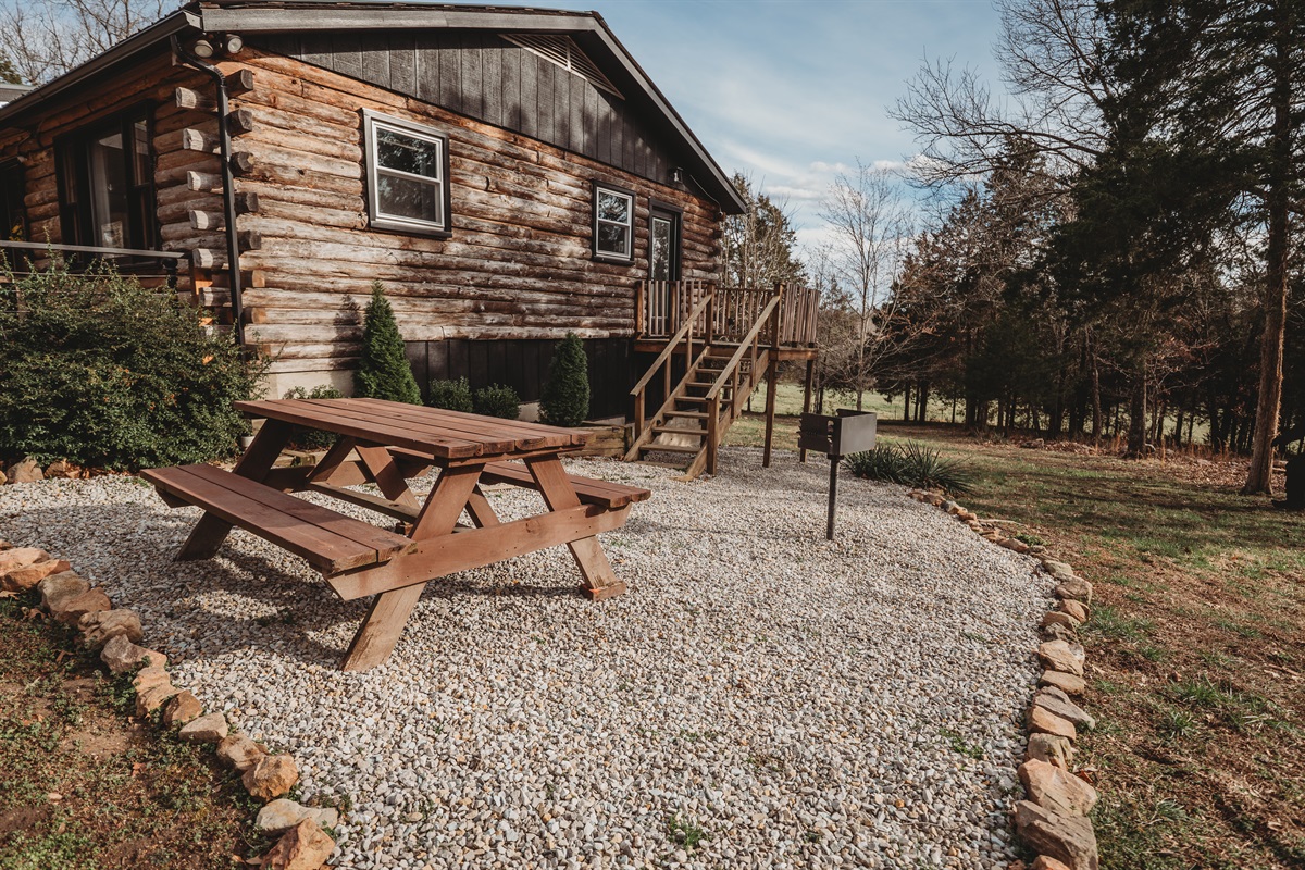Enjoy outdoor dining in the side yard, complete with a picnic table and BBQ grill&mdash;perfect for family meals under the open sky.