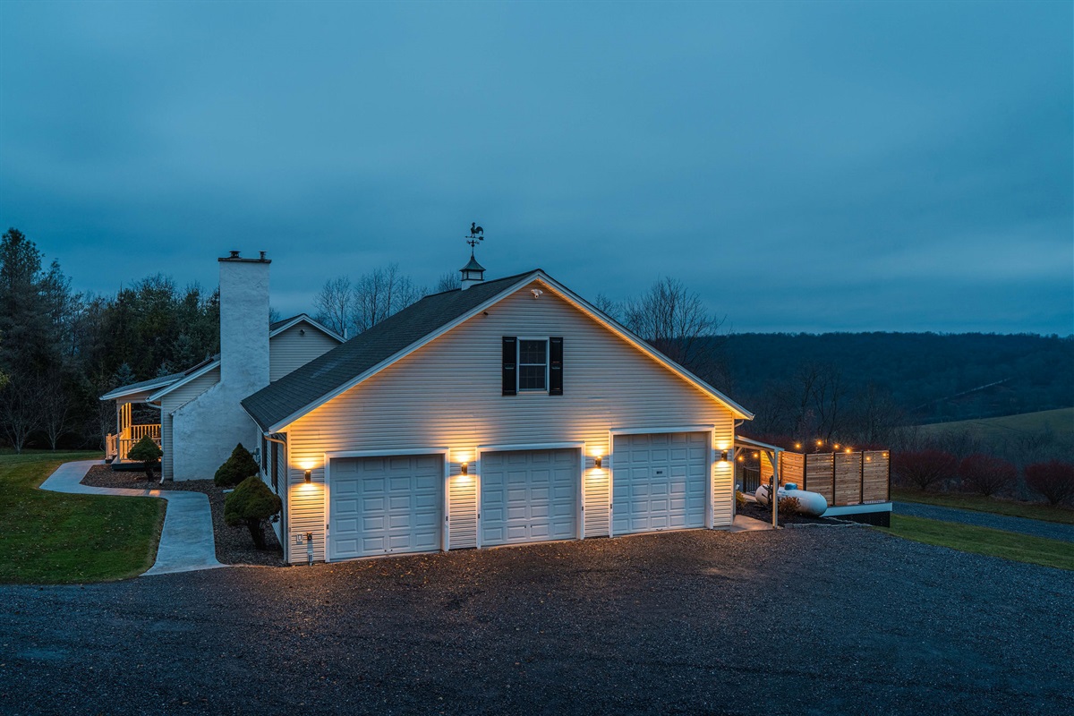 Spacious 3-car garage and ample parking with scenic mountain backdrop
