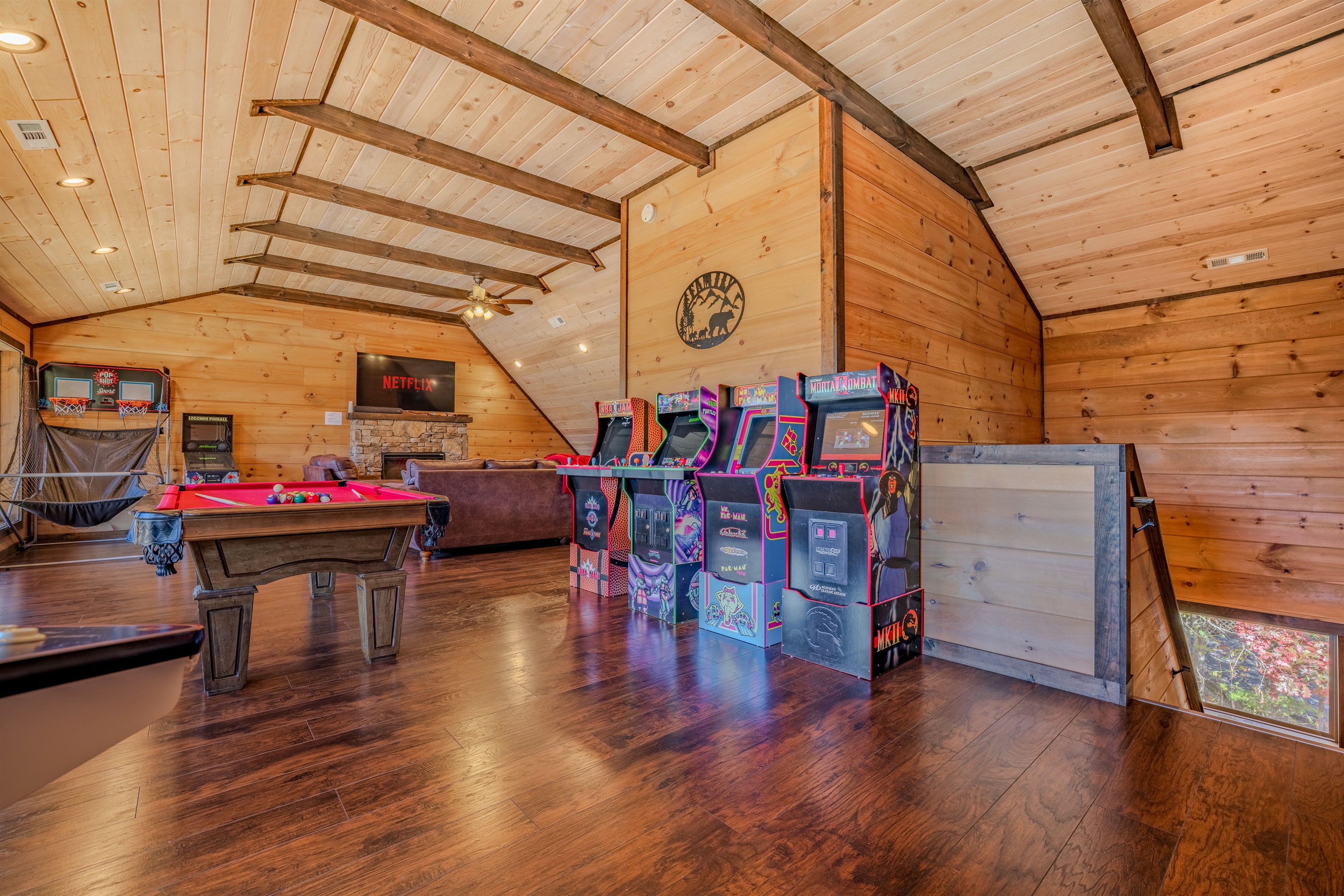 Arcade row, pool table, and tons of space — a gamer’s dream level.