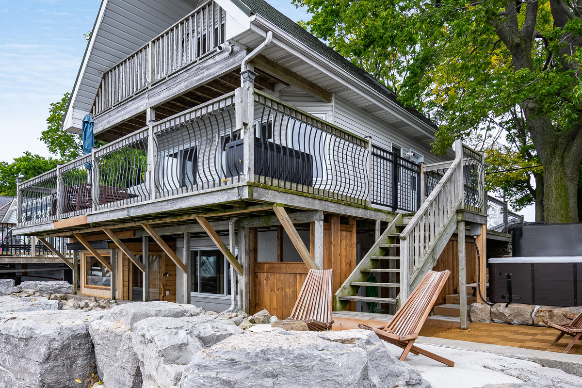 Elevated waterfront home with spacious wraparound deck