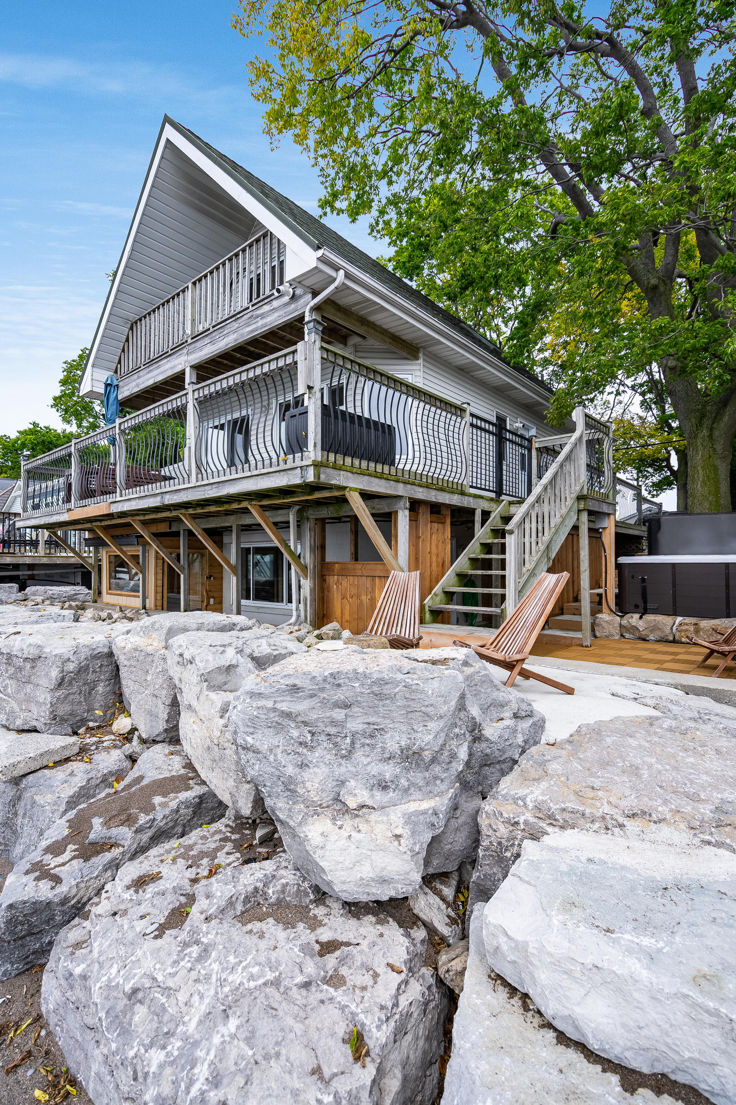 Elevated waterfront home with spacious wraparound deck