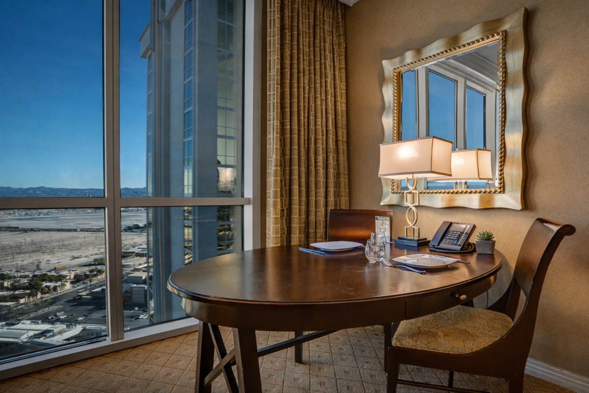 Work or dine with stunning floor-to-ceiling views—your perfect Vegas spot.