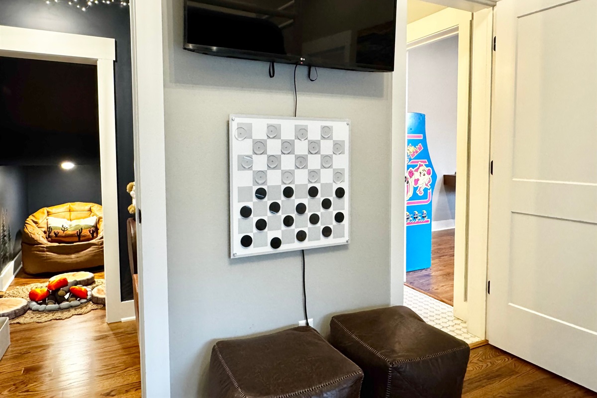 The double queen bunk room isn't just for sleeping. Watch a movie, play a game of wall checkers, or get lost in a good book in the hidden forest library!