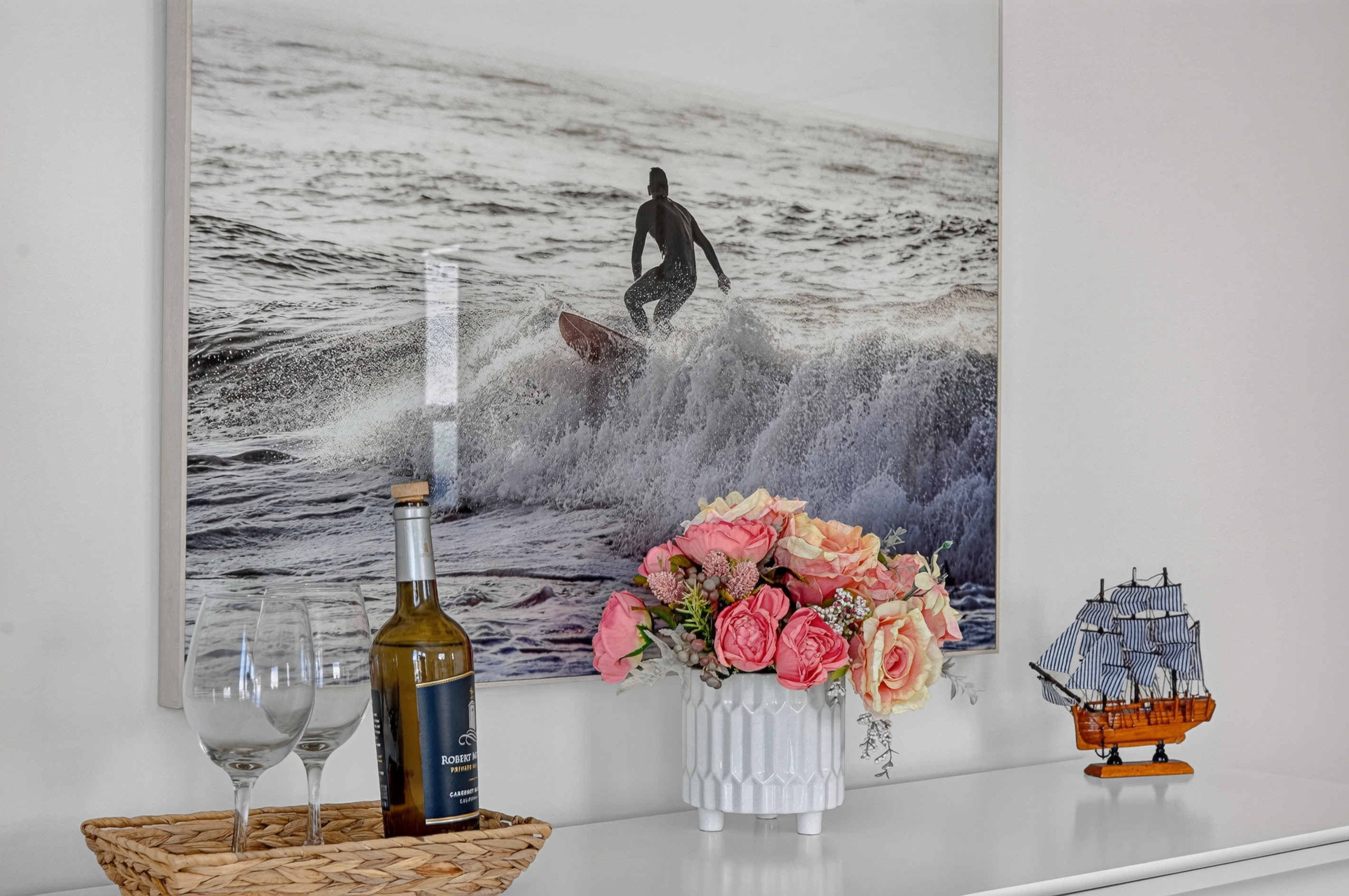 Thoughtful coastal décor adds a welcoming touch and reflects the home’s seaside setting.