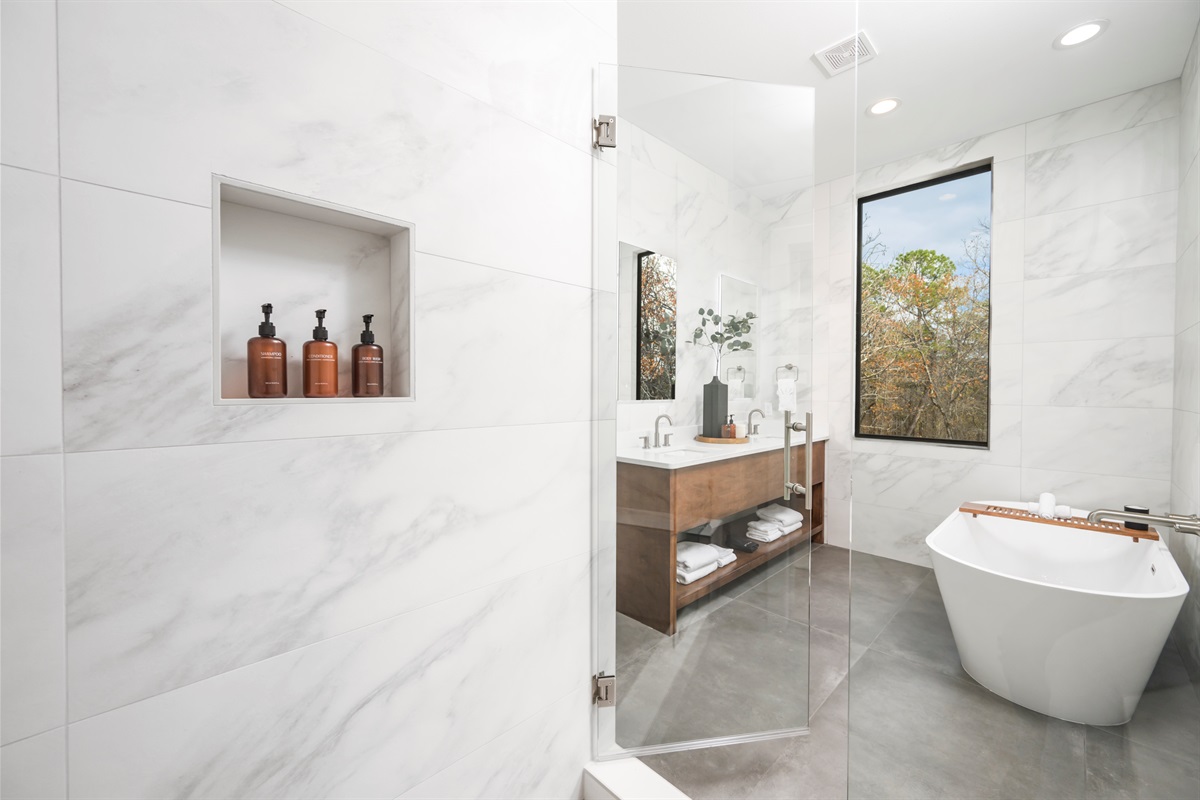 Ensuite Bathroom 2 - Attached to King Suite 2. Featuring oversized rain shower with dual showerheads, soaking tub and spa-quality marble finishes. Includes premium toiletries (body wash, shampoo, conditioner, hand soap) and hotel quality towels. 