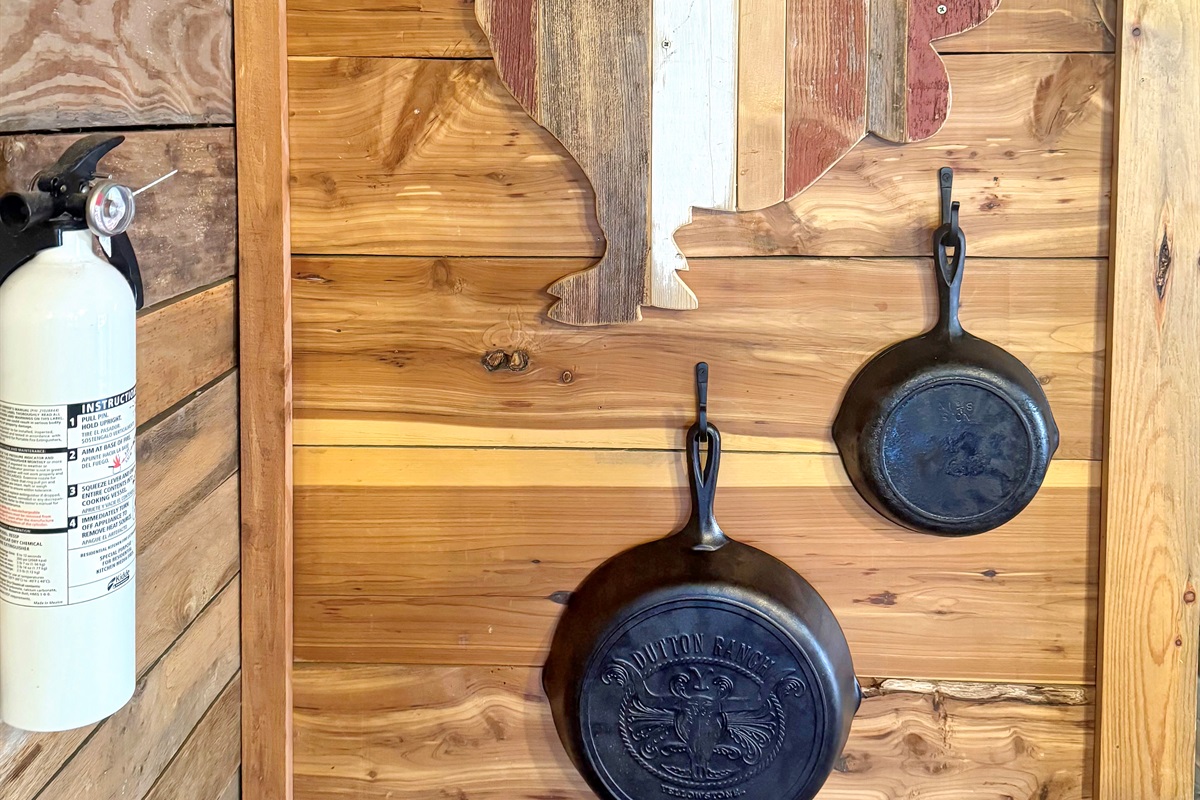 Cast iron skillets ready for your best campfire-style breakfasts - rustic cooking done right.