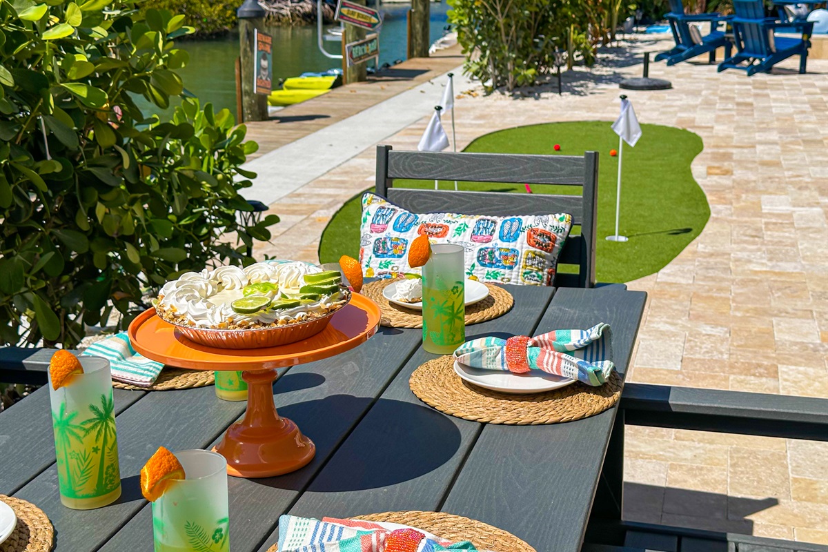 The second outdoor dining table seats 6 people.