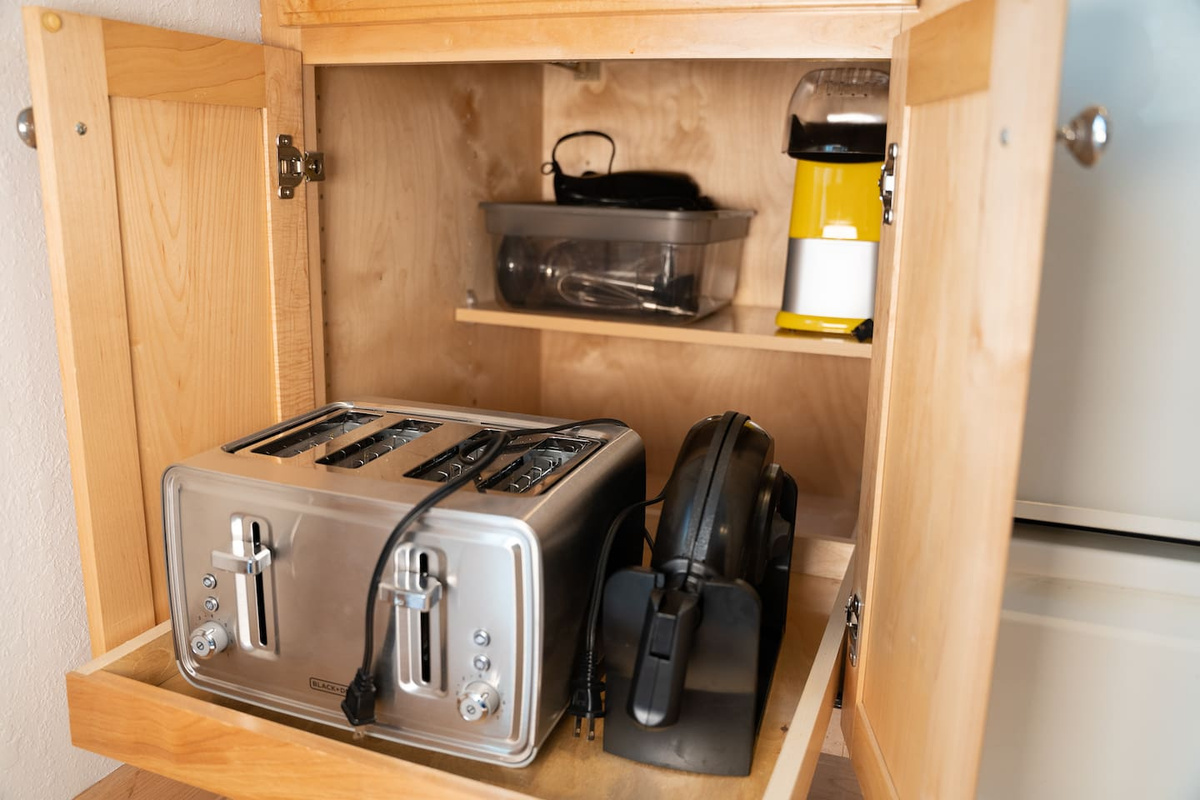 The Kitchen is stocked with nearly every kitchen appliance you can think of.  Including a toaster, waffle iron, popcorn popper......