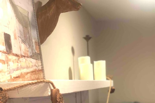 Antique mantle (repurposed from 1940 Christmastown/McAdenvillle home) in the Master bedroom adds to the charm!