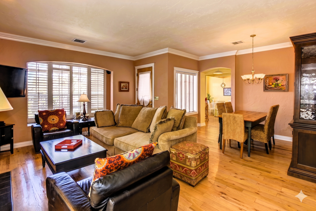 Relax in the spacious, open-concept living room, flowing right into a modern, fully-equipped kitchen. Perfect for gathering!