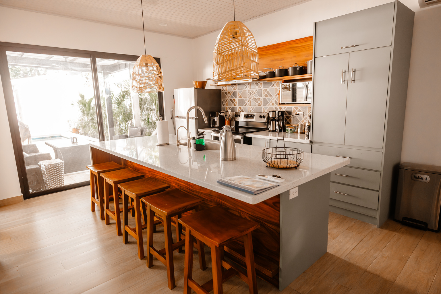 The kitchen opens onto the terrace. Pour a coffee, slide the doors, day starts.