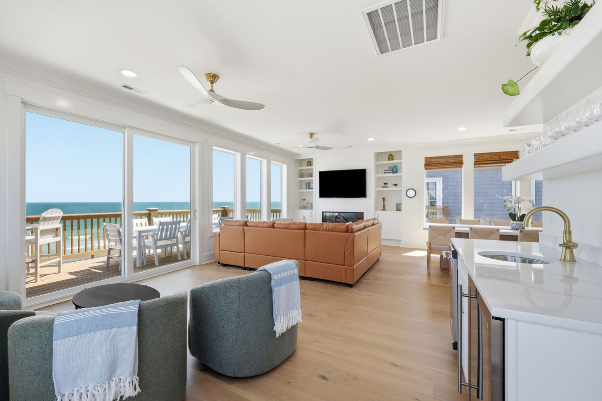 Expansive oceanview living area that brings the coastline into every moment with floor-to-ceiling coastal views
