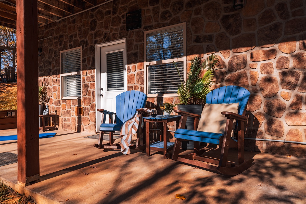 A cozy porch with two chairs, inviting relaxation and outdoor enjoyment.