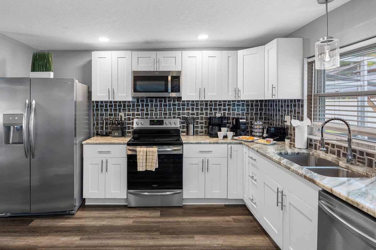 With updated appliances, polished countertops, and elegant cabinetry, this kitchen blends modern aesthetics with everyday functionality.