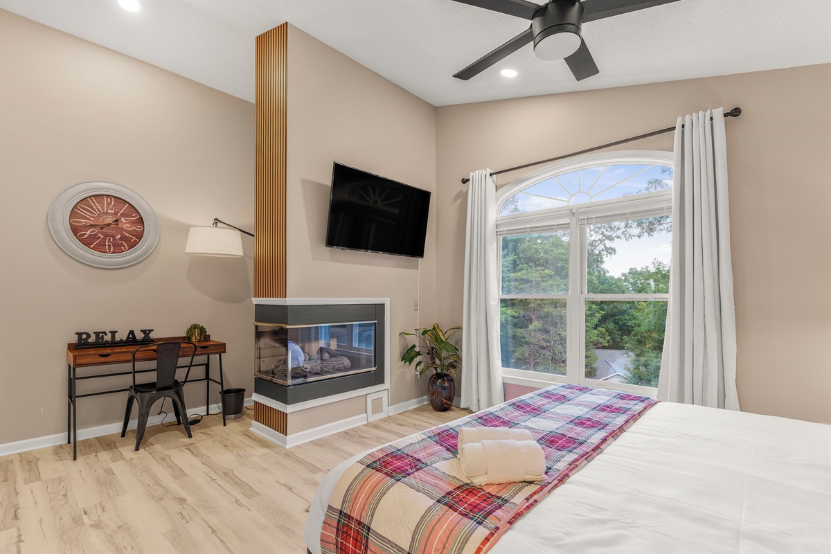BR3: Upstairs master king bedroom with propane fireplace, and ensuite bathroom
