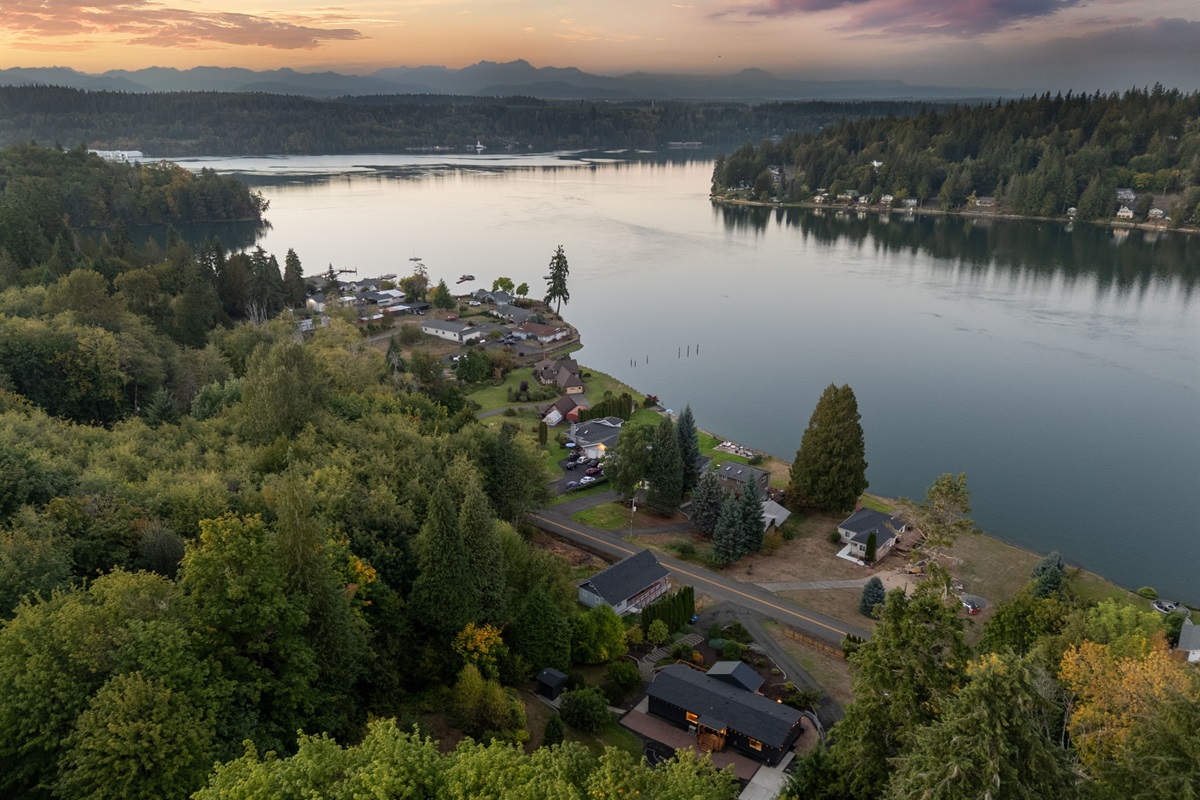 Experience peaceful evenings with stunning inlet views and the home’s welcoming glow