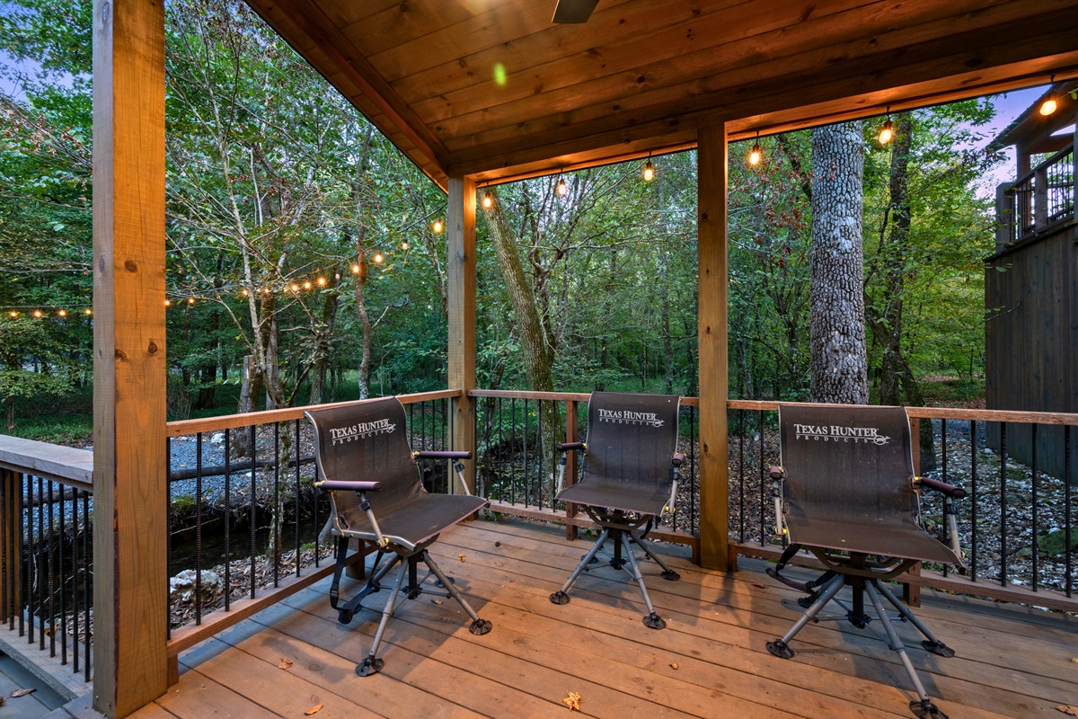 This covered deck area offers a laid-back spot with seating and a table, perfect for morning coffee or evening conversations.