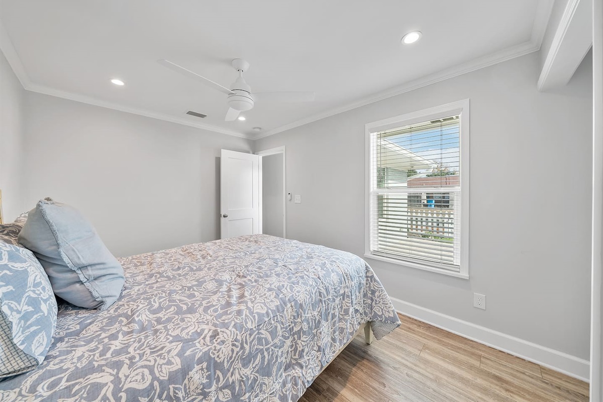 Guest room of Unit A with a queen bed. 