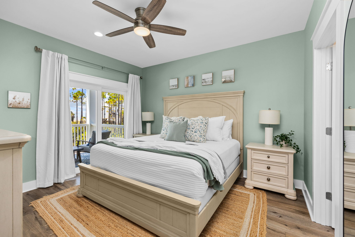 Retreat to the spacious King suite featuring soft coastal décor and direct access to the Gulf-view balcony.