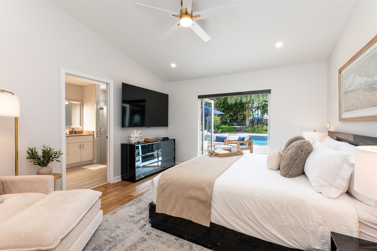 Sliding doors in the primary bedroom provide direct access to the pool deck&mdash;perfect for morning swims or evening relaxation.