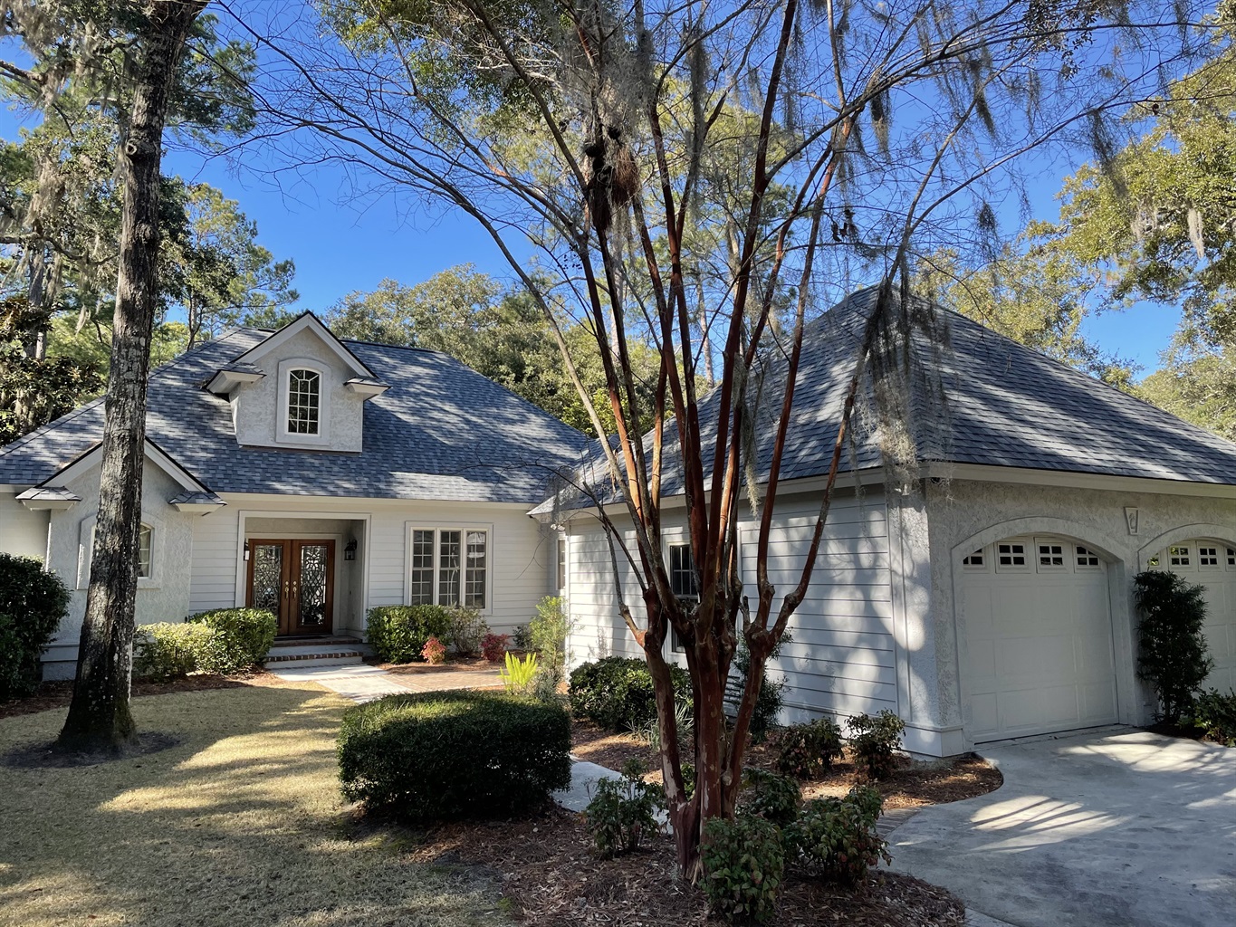 Front of house, driveway and garage