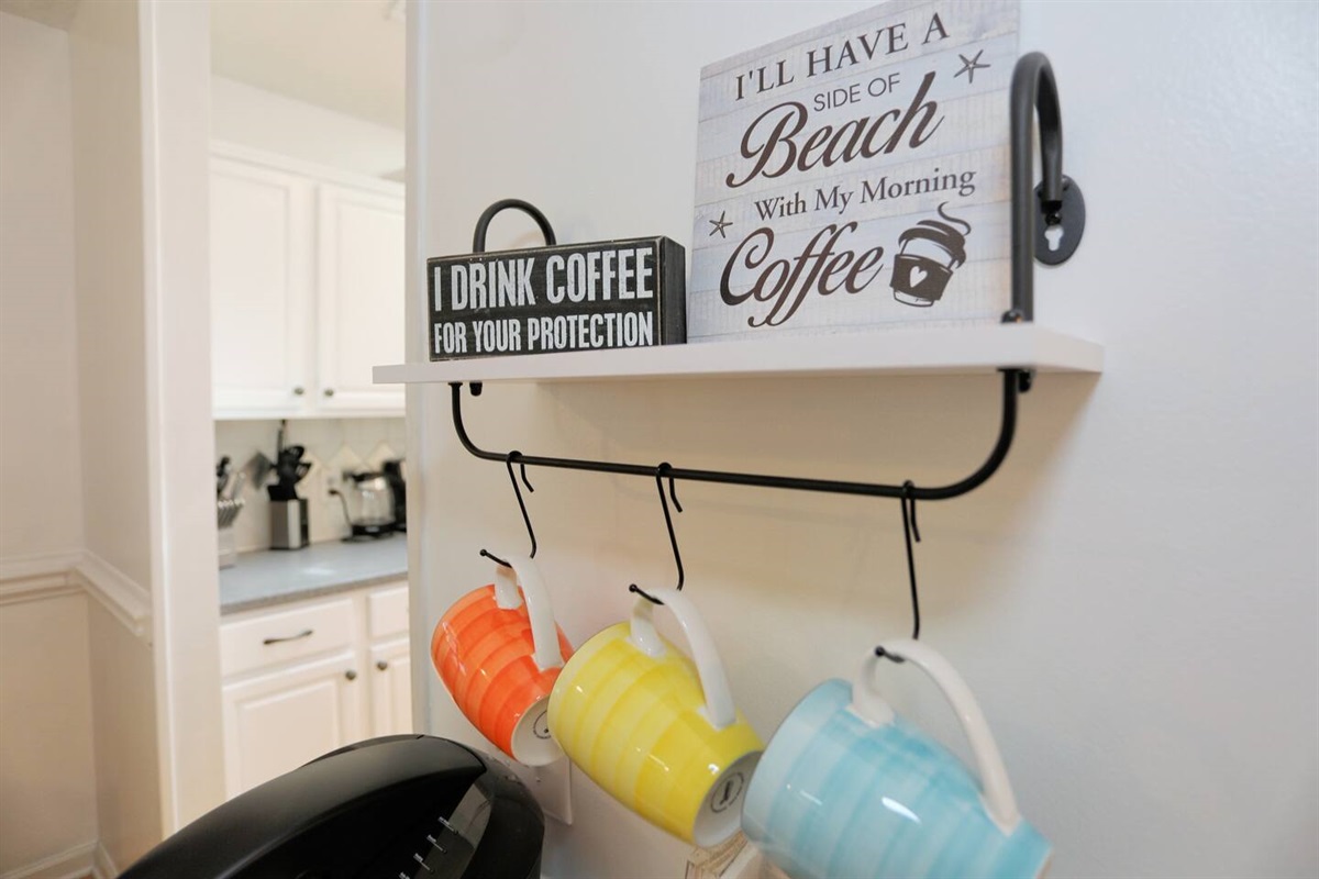 Start your day at the fully stocked coffee bar, complete with coffee pods, sugar, creamer, and tea for the perfect morning brew.
