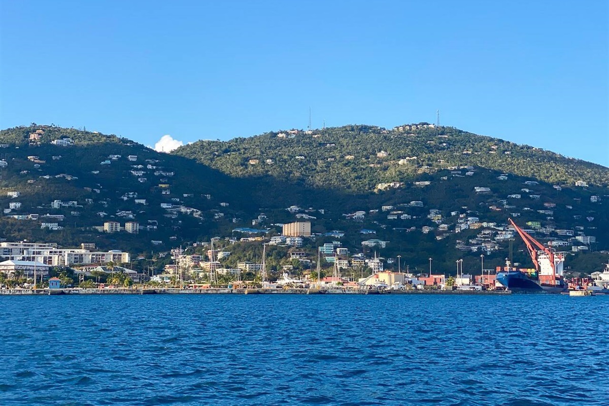 Relax at the pool overlooking stunning blue waters.