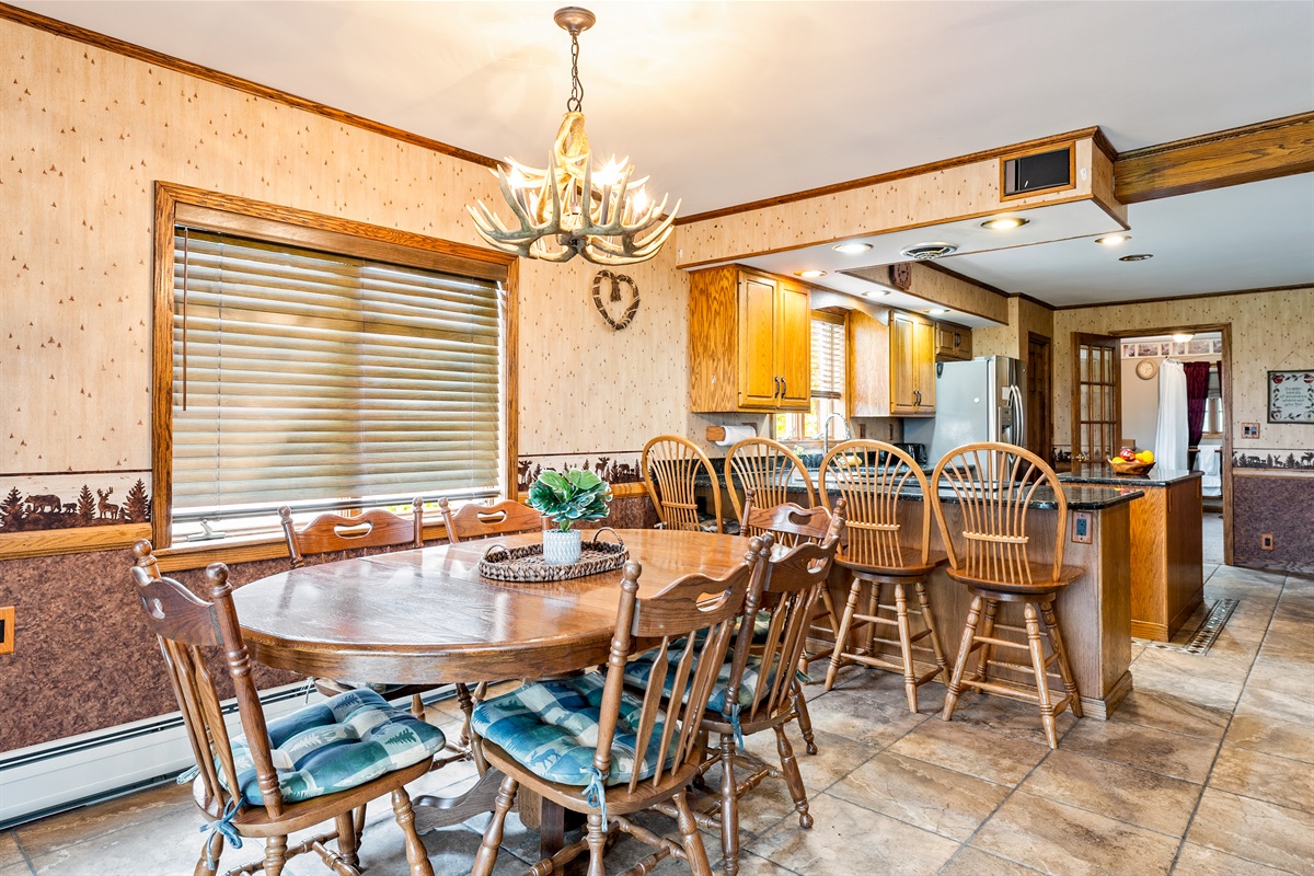 Open-concept dining room seamlessly connects to the kitchen, creating the perfect gathering spot