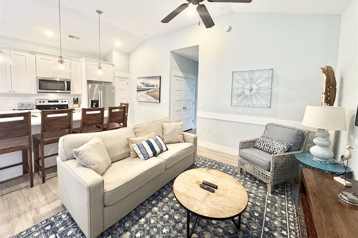 Open-concept living room and kitchen with comfortable seating