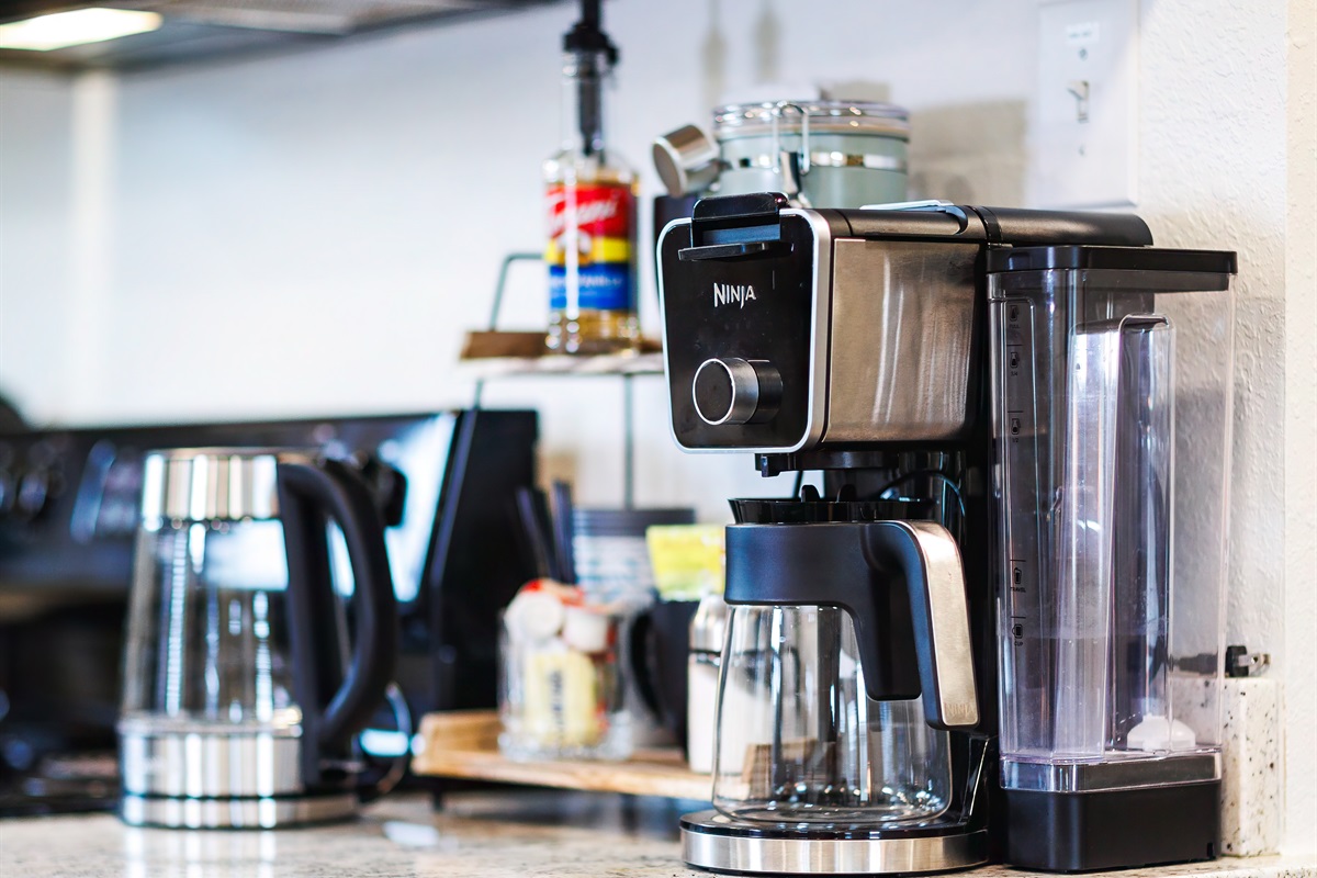 Start your day right at the coffee bar&mdash;stocked with coffee, creamer, sugar, syrups, K-Cups, kettle, and a full pot brewer!