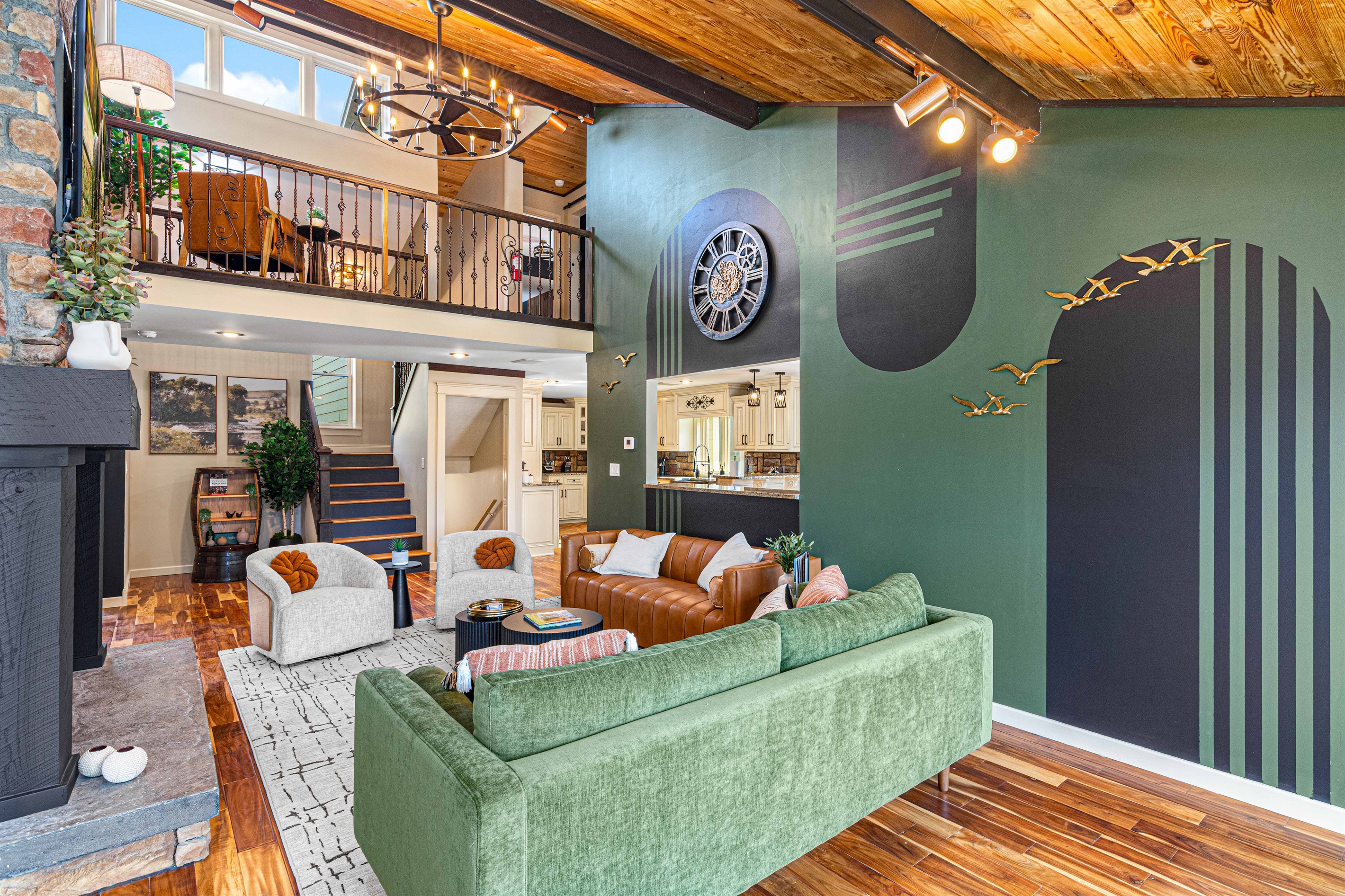 Main living room with easy on gas fireplace adjacent to kitchen