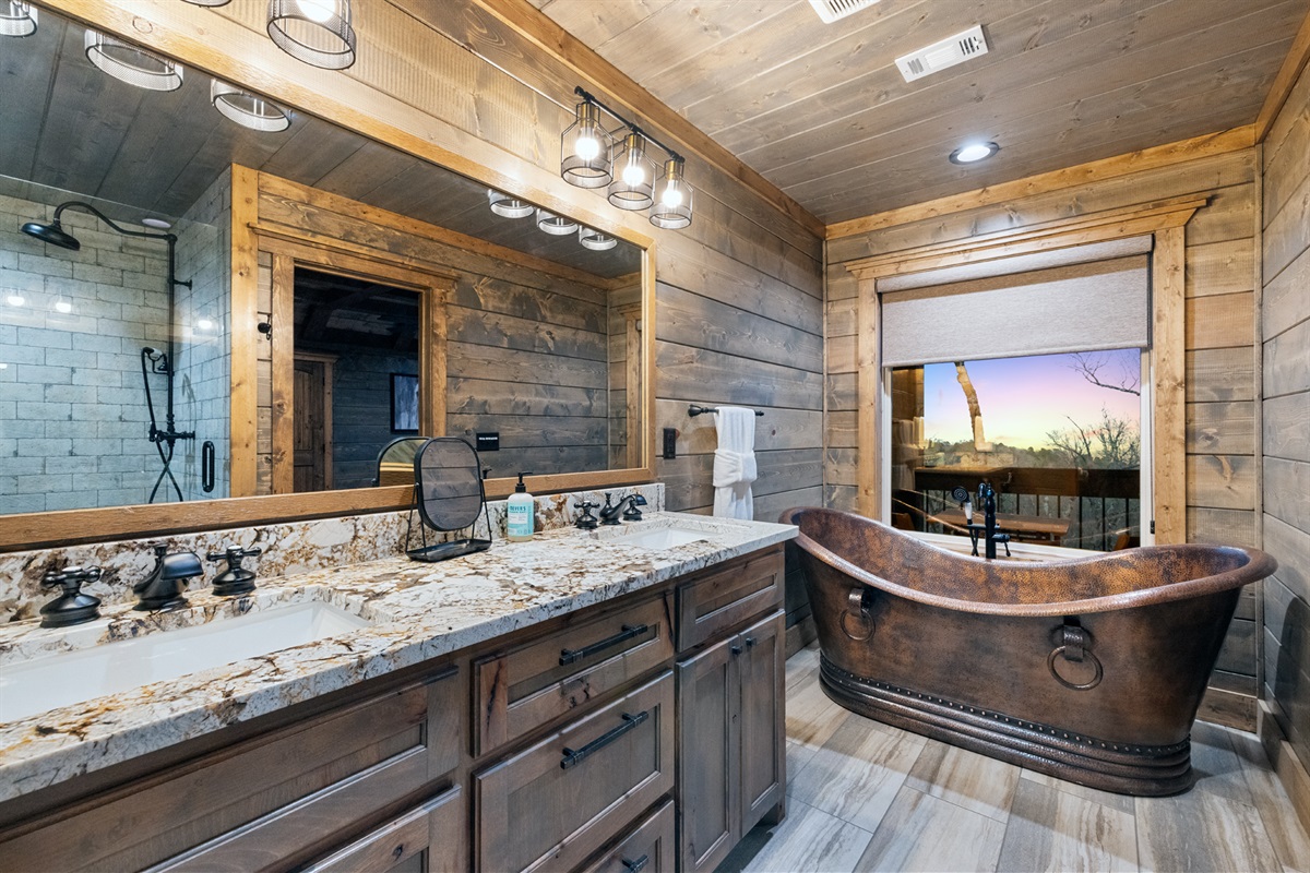 Elegant bathroom featuring a copper soaking tub 
