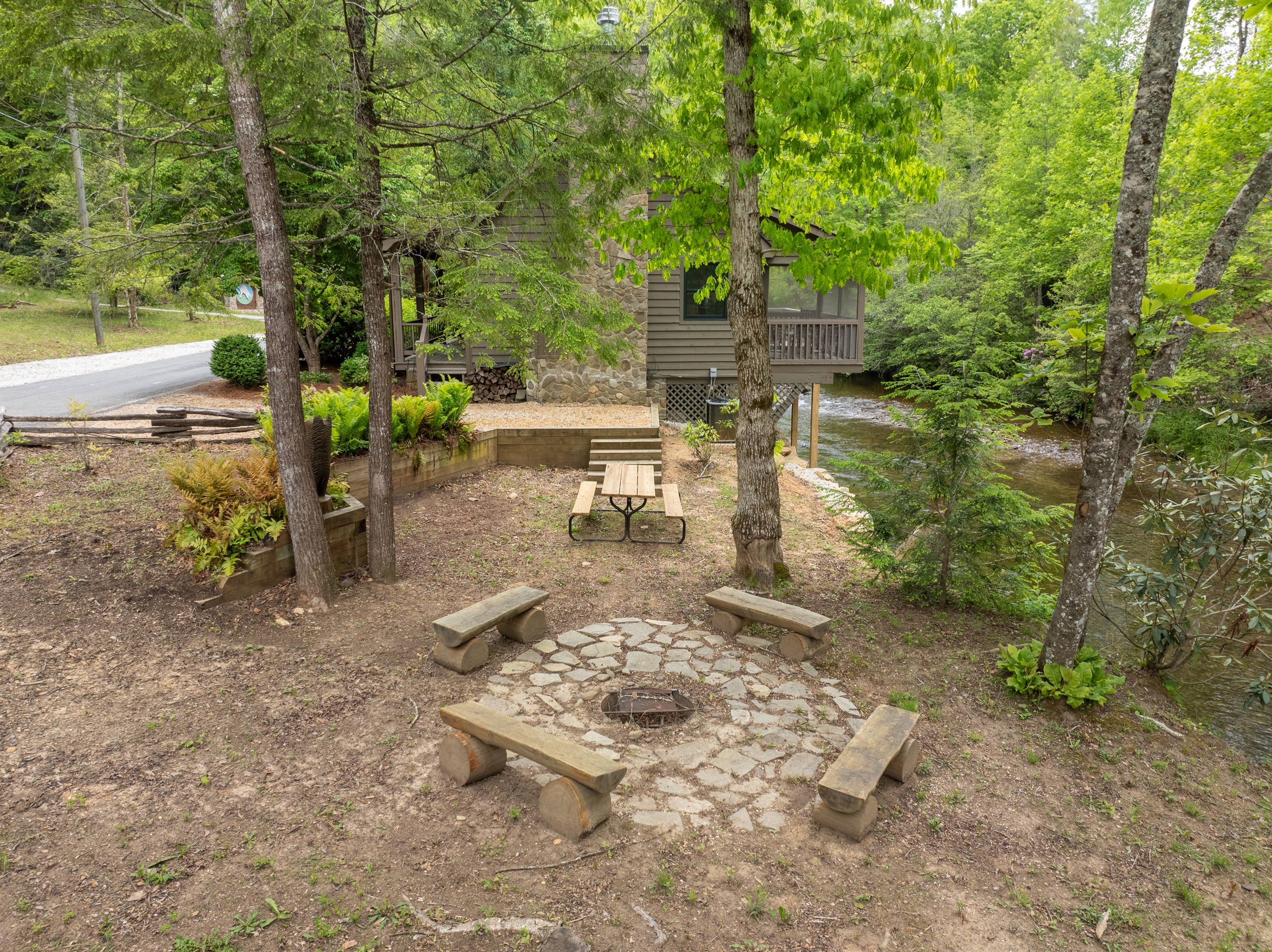 Gather around the in-ground fire pit and enjoy the peaceful sounds of Snowbird Creek flowing nearby. Firewood is not guaranteed, so guests may wish to bring their own.