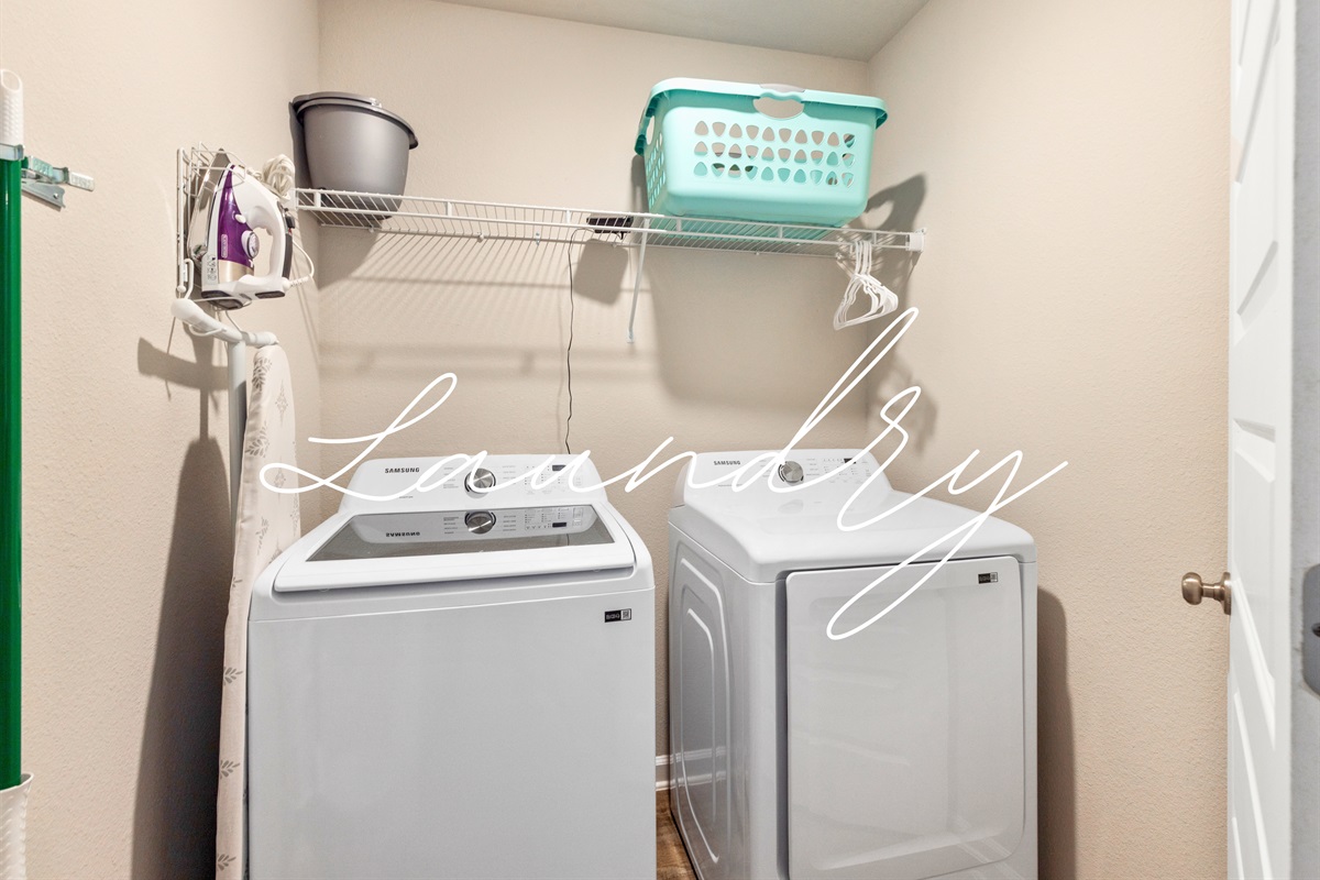 Convenient laundry room with washer and dryer to keep your beach gear fresh.