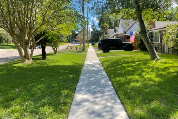 Sidewalk view in front of the home.  This neighborhood is clean, peaceful, and great for walking/jogging. 